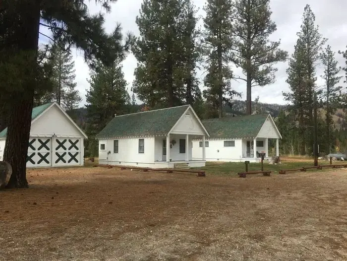 The cabins are nestled in the pines with running hot water, beds to sleep 4, bathroom, shower with a picnic table, fire ring and pedestal grill located behind the cabin.