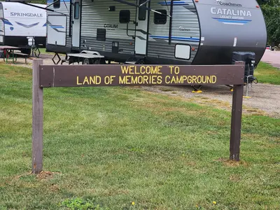 Welcome to Land of Memories Campground sign