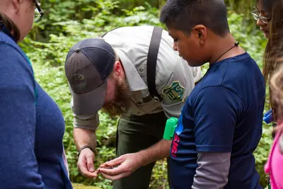 Naturalist with youth at Baker Lake, Mt Baker Snoqualmie National Forest (31270318554)