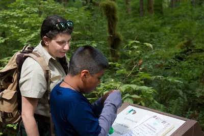Forest Service Naturalist with boy at Baker Lake, Mt Baker Snoqualmie National Forest (32072628626)