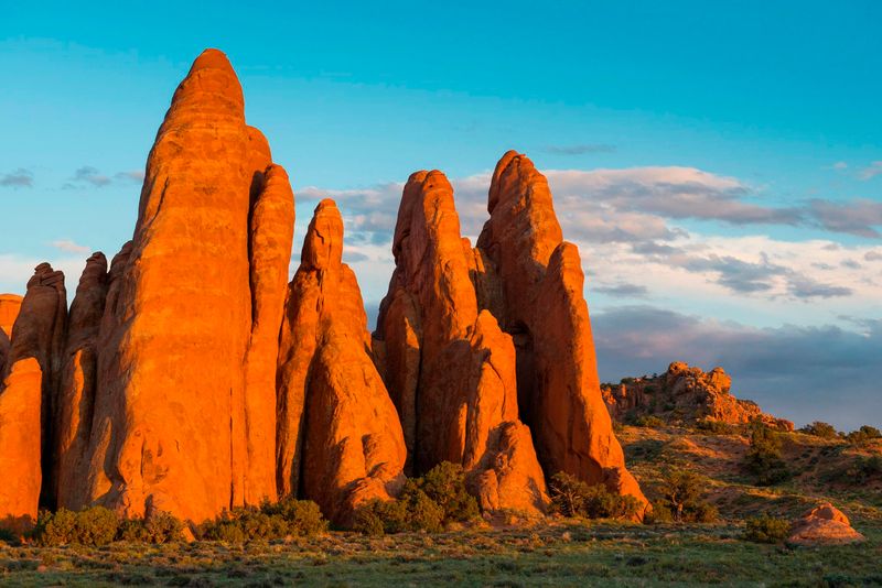 Red sandstone fins glow in sunset lighting