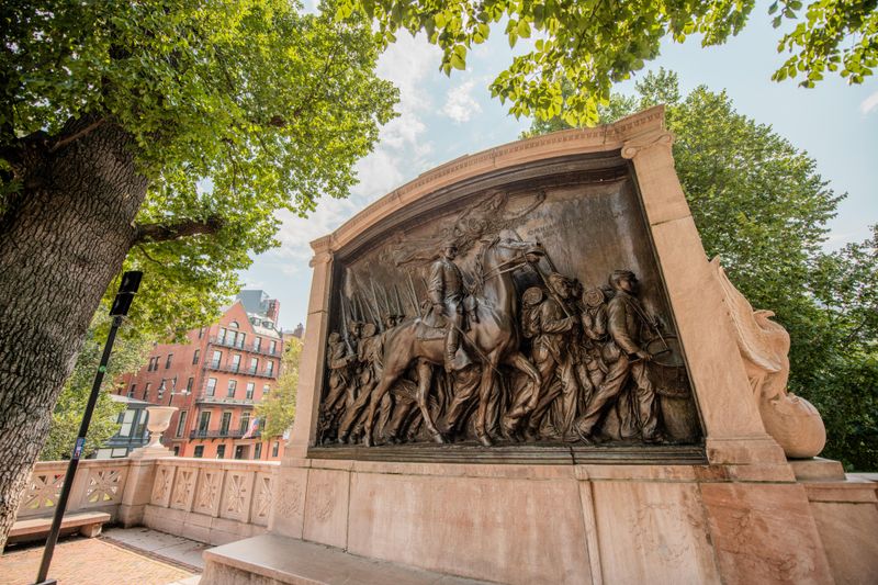 A large bronze statue showing a man on horseback and soldiers walking alongside him