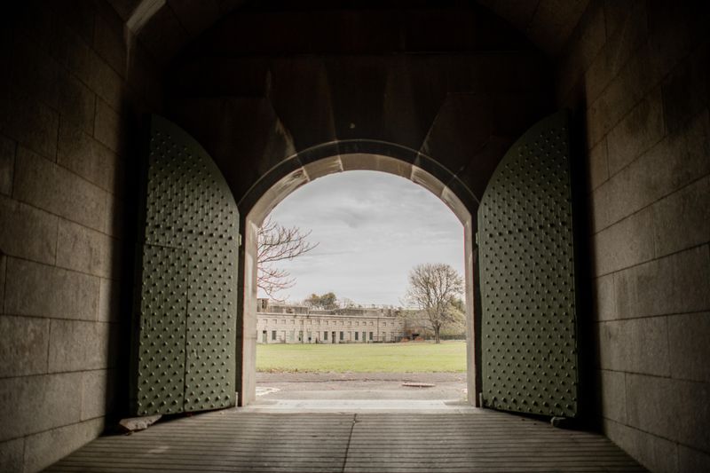 A big arched door opens to the parade ground of Fort Warren.