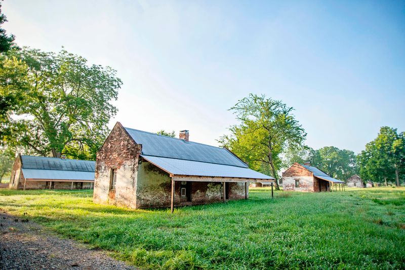 Brick cabins built to house enslaved workers, served as homes for tenant farmers into the 1960s.