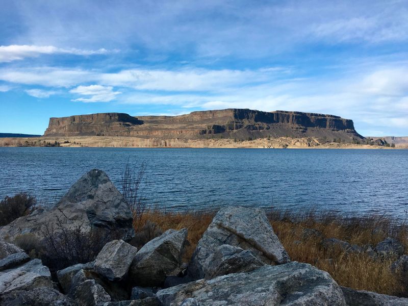 Large butte with lake in the foreground
