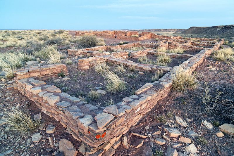 Masonry wall foundations are all that are left of a hundred room pueblo