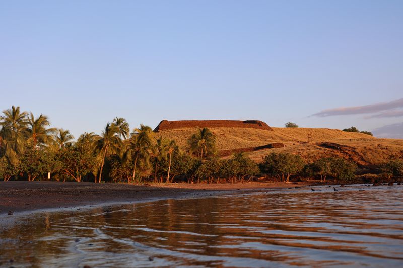 Heiau standing high above Pelekane Bay, as seen at sunset.
